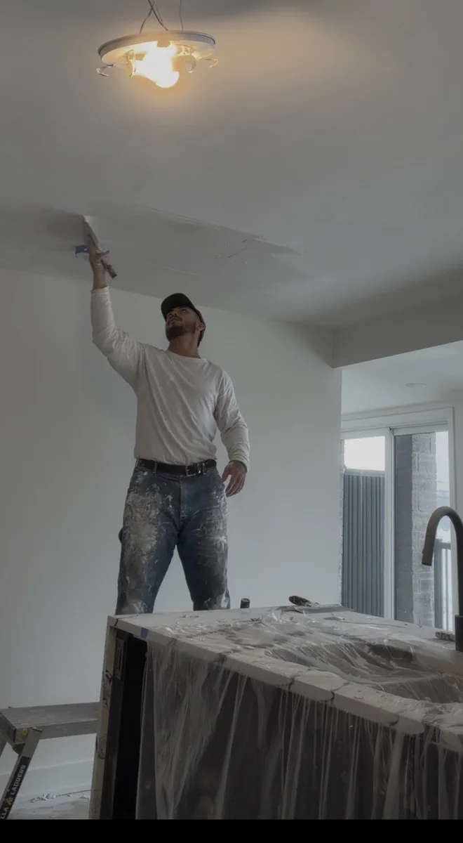 Contractor carrying out detailed interior finishing